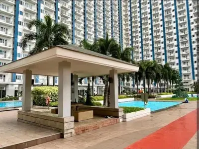 a pavilion in front of a large apartment building at Cozy Modern 1BR Light Residences with 55 inches 4K TV in Manila