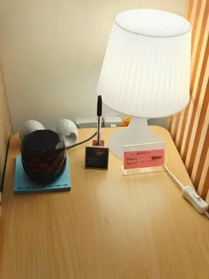 a table with a lamp and a bowl on it at Cozy Modern 1BR Light Residences with 55 inches 4K TV in Manila