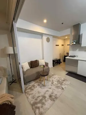 a living room with a couch and a table at Azure Urban Resort Residences in Manila