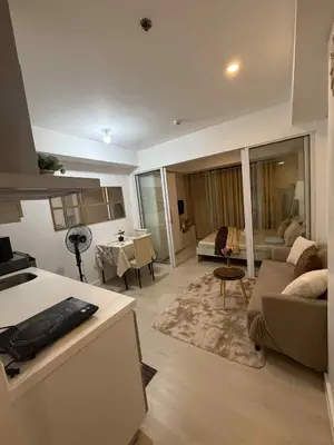 a living room with a couch and a table at Azure Urban Resort Residences in Manila