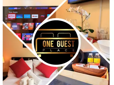 a picture of a one guest place sign in a room at Comfy Stays in Shell Residences by OneGuestPlace in Manila