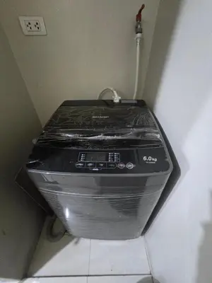 a toaster oven in a corner of a room at Newport Staycation in Manila