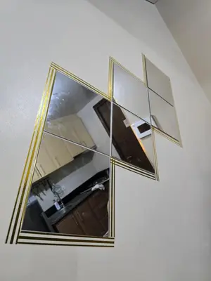 a mirror with a reflection of a kitchen in it at Newport Staycation in Manila