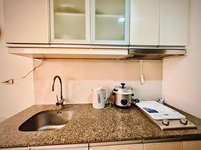 a kitchen counter with a sink and a toaster at 101 Newport Boulevard near NAIA Terminal 3 in Manila