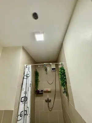a bathroom with a shower with plants in it at J&A Cozy Calm Stay in Biñan