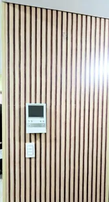 a wall with a tv and a computer on it at Cozy Modern Studio Two Palm Tree Villas in Manila