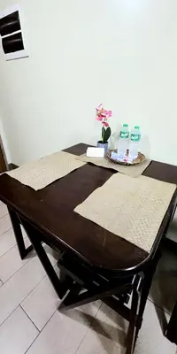 a table with two bottles ofodorizers on top of it at Cozy Modern Studio Two Palm Tree Villas in Manila