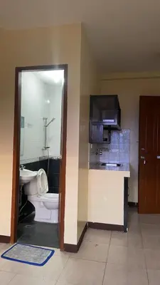 a bathroom with a toilet and a sink at Studio Type Manila in Manila
