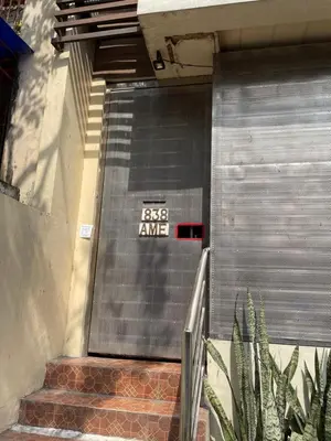 a set of stairs with a sign on the side of a building at Studio Type Manila in Manila