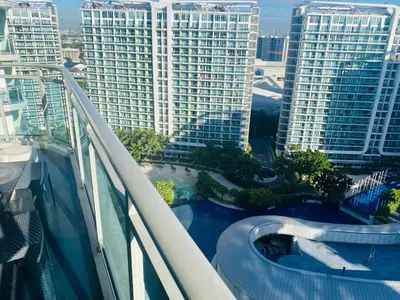 arial view of a swimming pool on a balcony of a building at Azure Urban Resort Residence A51 in Manila