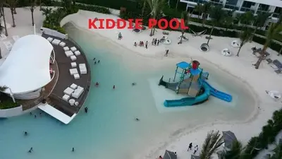 an aerial view of a water park with a slide at Azure Urban Resort Residence A51 in Manila
