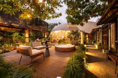 a garden with a large glass dome in a building at Container Home Mandaluyong N03 in Manila