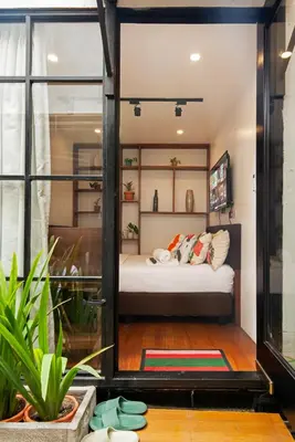 a room with a bed and a window at Container Home Mandaluyong N07 in Manila
