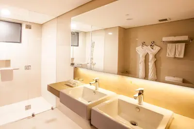 a bathroom with a sink and a mirror at Jinjiang Inn - Makati in Manila