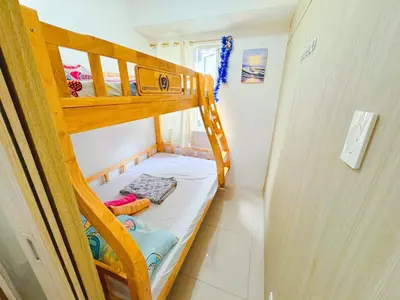 a small room with two bunk beds in it at Manila Bay View Shore1 Residence Tower A in Manila