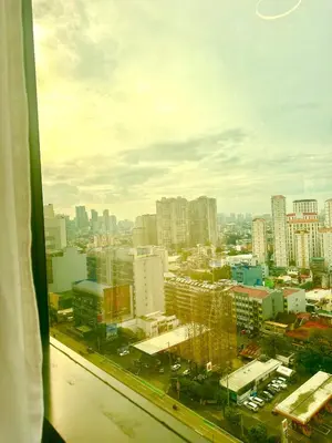 a view from a window of a city with buildings at City Escape by Fame in Manila
