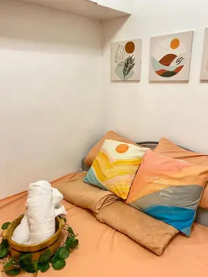 a room with a bed with towels on it at Your Comfort Zone Staycation2 in Manila