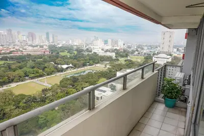 a balcony with a view of the city at Eton Baypark Manila Bay in Manila