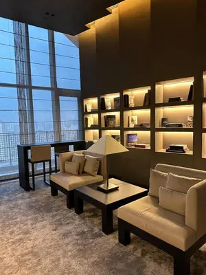 a living room with couches and a table with a lamp at New Modern Luxurious 1 Bedroom Condo with WIFI and Netflix in Manila