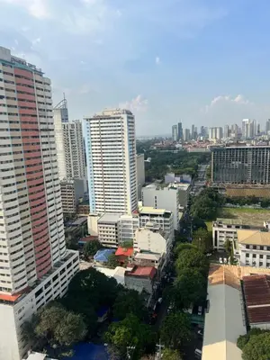 an aerial view of a city with tall buildings at Robinson's place residences tower 2 in Manila