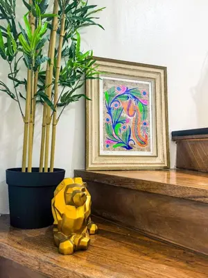 a stuffed animal sitting on a table next to a plant at CitiClcentro Condo Near everything in Manila