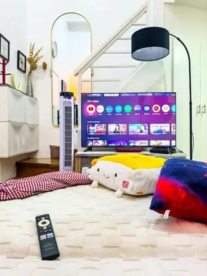 a bedroom with a bed with a tv on it at CitiClcentro Condo Near everything in Manila
