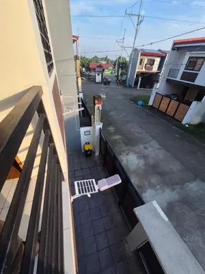 an outside view of a balcony of a building at Casa Deña Lawa - Cozy Staycation in Calamba in Calamba