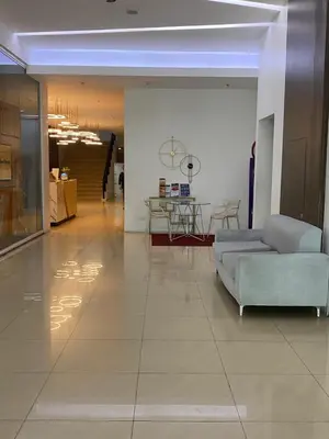 a living room with a couch and a table at Edsa Heights Unit 3416 Cozy 1 br Loft Penthhouse Unit with 2 full beds Ama Tower in Manila