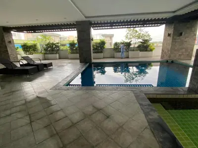 a swimming pool in the middle of a building at Edsa Heights Unit 3416 Cozy 1 br Loft Penthhouse Unit with 2 full beds Ama Tower in Manila
