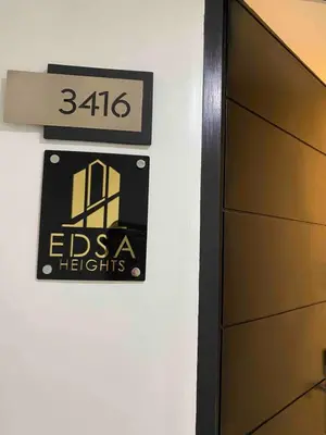 a sign on a wall next to a door at Edsa Heights Unit 3416 Cozy 1 br Loft Penthhouse Unit with 2 full beds Ama Tower in Manila