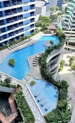 an overhead view of a swimming pool in a building at Skyline Serenity at 52F & Cozy City Escape Views in Manila