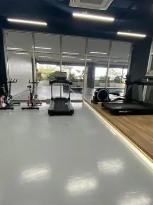 a gym with two exercise bikes and a treadmill at EDSA Heights Unit 3422 Two br Penthouse Loft Unit AMA Tower residences in Manila