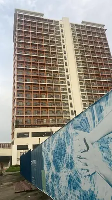 a large building with a painting of a dog in front of it at The Courtyard Contemporary Studio at Taguig WiFi in Manila