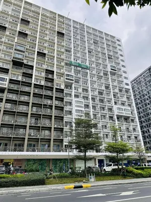 a large apartment building with a street sign in front of it at Shore Residences in Manila