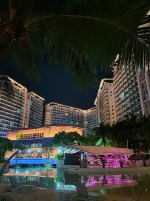 a view of a hotel at night with buildings at Bahamas tower 1604 in Manila