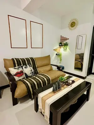 a living room with a couch and a coffee table at Staycation in Manhattan by House of Mereu in Manila