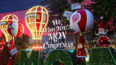 a sign that says we wish you a moa mo christmas at Pasay Moa Stay at Shell Residences in Manila