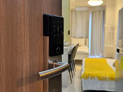 a room with a door with a room with a bed at S Residences Family Room 512 by Prime Stay MOA in Manila