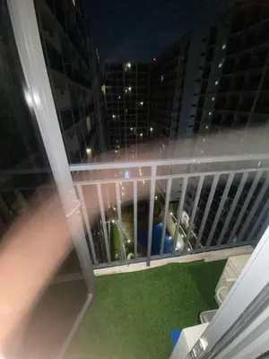 a view from the balcony of a building at night at H&M staycation Shore 2 tower 2 in Manila