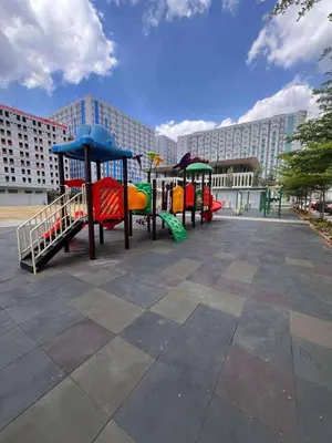 a group of playground equipment in a park at Coco Home in Manila