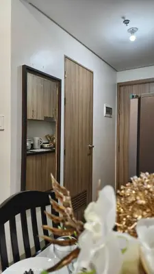 a table with a plate of food on top of it at Shore Residences Pasay in Manila