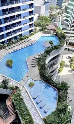 an overhead view of a building with a pool at Air Residences Minimal Style Unit w Balcony - Near Trident Tower and Salcedo in Manila