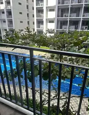 a view of the blue water from a balcony at SHORE 2 TOWER 3 Near MOA Easy Vacation Shopping Center in Manila