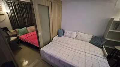 a small bedroom with a bed in a room at Book ME at Shore Residences Tower D near Airport & Mall of Asia in Manila
