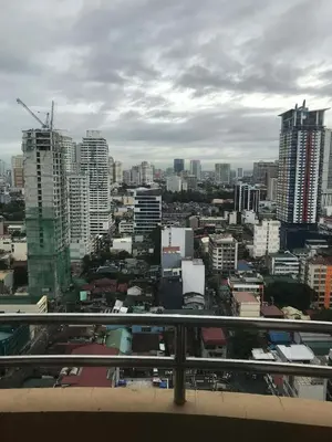 a view of a city with tall buildings at Birch Tower Manila by JL in Manila
