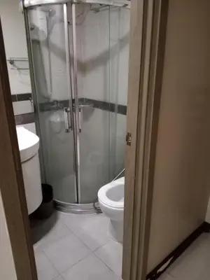 a bathroom with a shower and a toilet at Affordable condotel paranaque in Manila