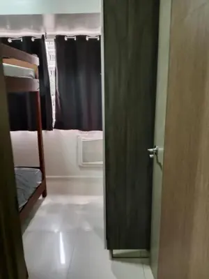 an open door to a room with a bunk bed at Affordable condotel paranaque in Manila
