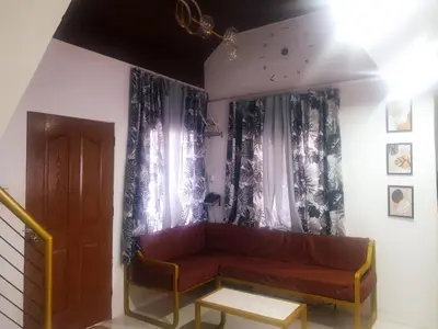 a living room with a couch and a window at Fernica Boarding House in Carmona