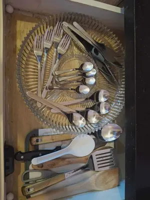 a basket full of utensils in a drawer at 4V North Wing in Manila