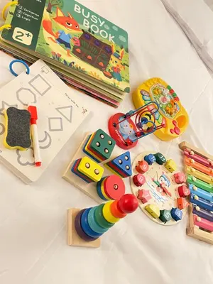 a toy train and a book and some toys at Condo in Paranaque Near NAIA- Azure Paranaque in Manila